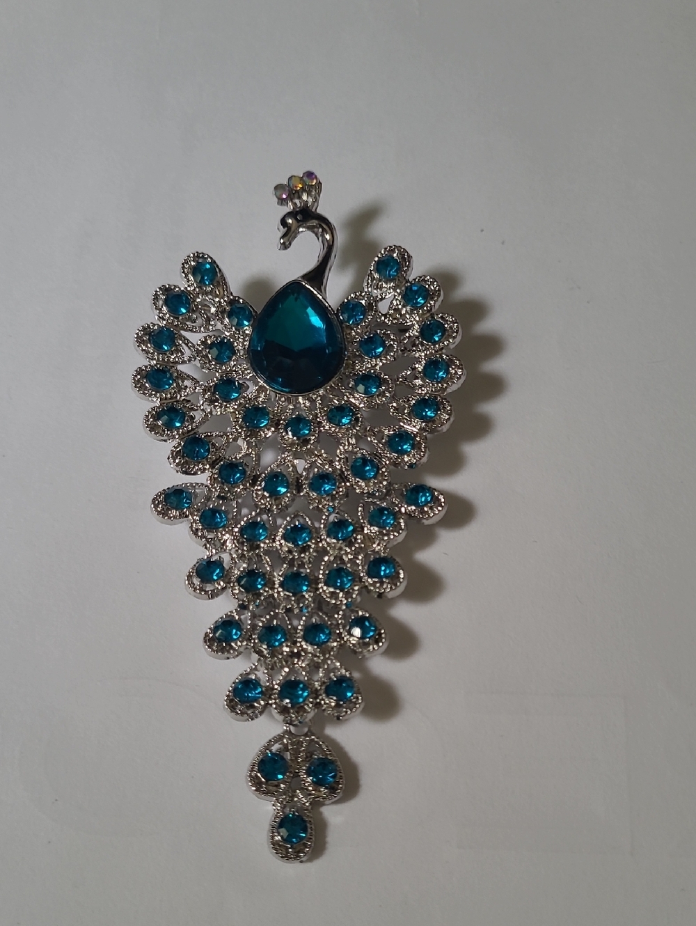 Silver Peacock Pendant with Teal Blue Crystals